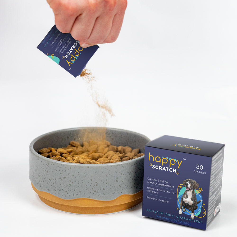 Happy Scratch pet allergy supplement being added to food bowl